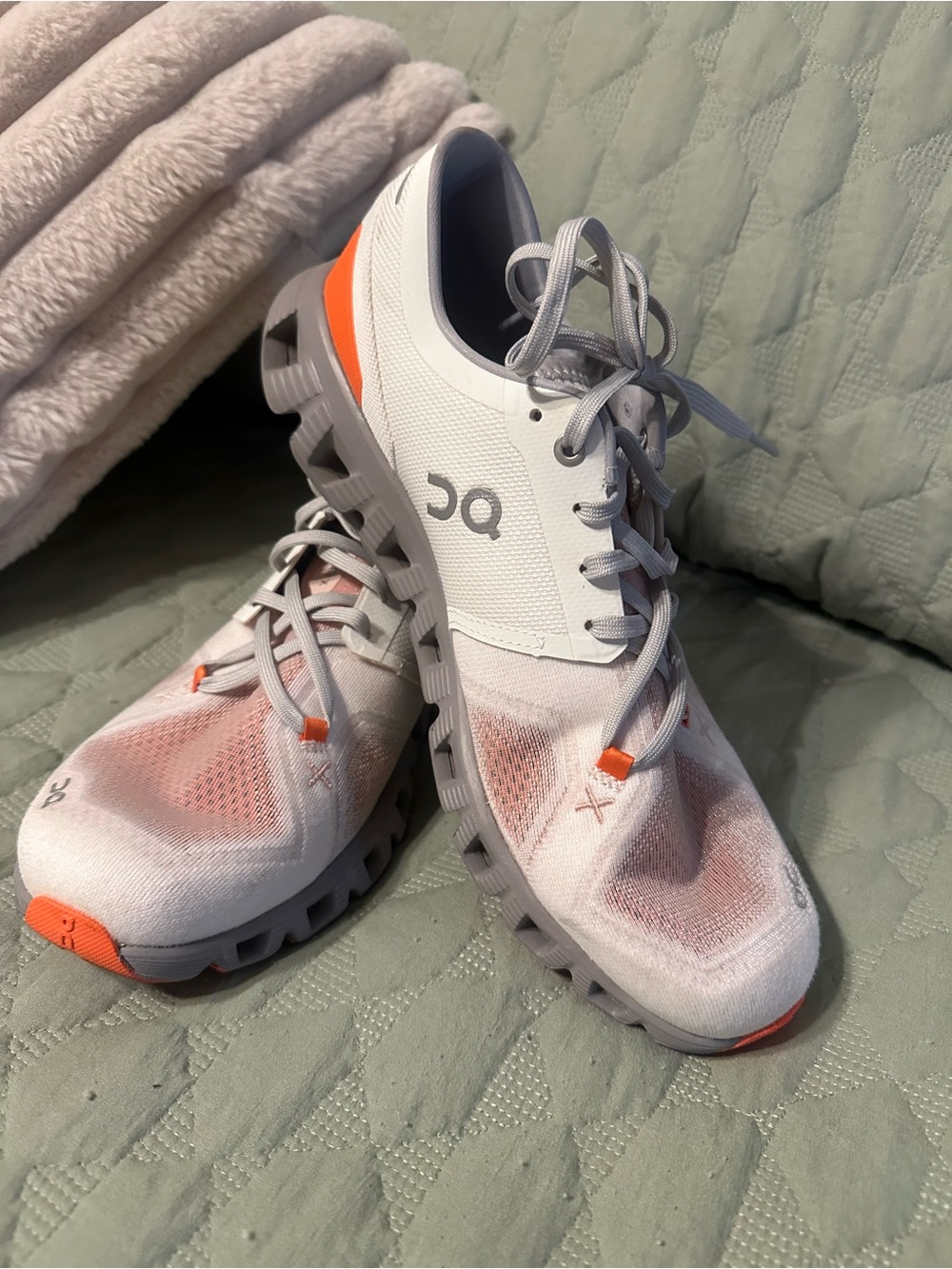 On Running Women’s Cloud Running Shoes in White and Orange Accent